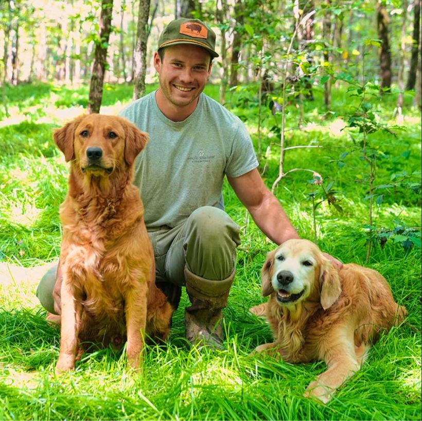 Moki and Nakoa, the company dogs, with Evan